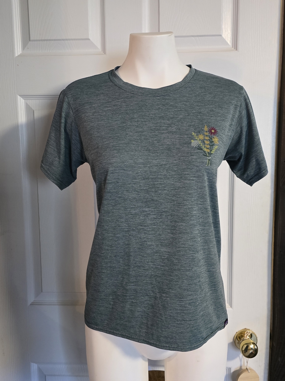 Patagonia Heathered Teal Crew Neck Tee with Floral Chest Graphic